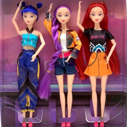 Three dolls with colorful outfits standing against a reflective surface.
